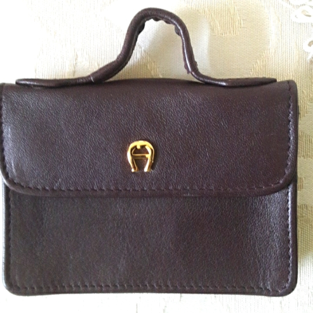 Aigner leather change purse. The color is deep burgundy